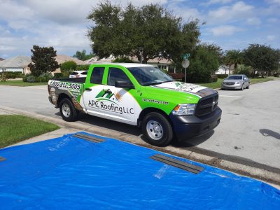 APC-Roofing-in-Florida- APC Roofing's vehicle with a contact number