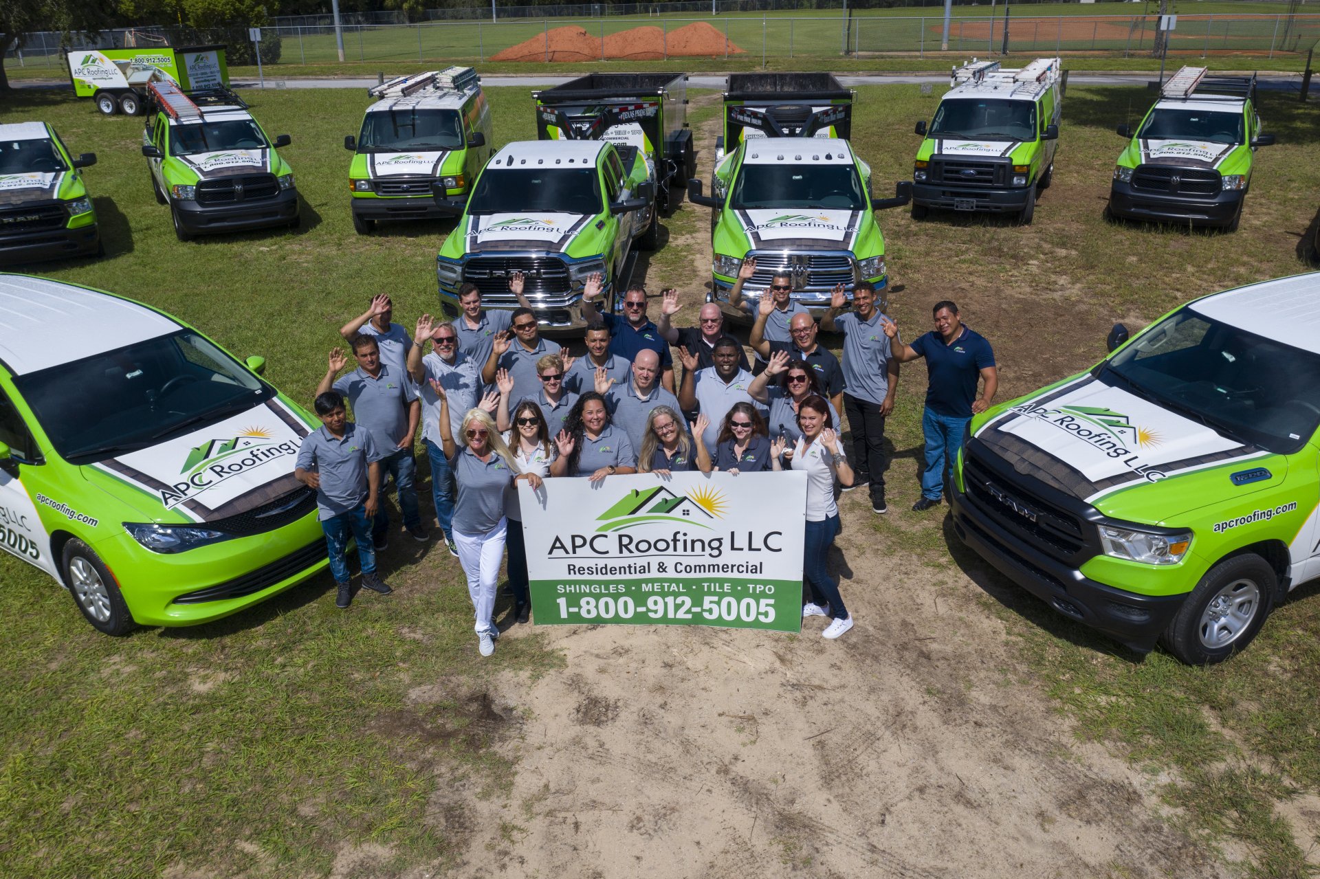 APC Roofing in Clermont, FL - Picture of Staff and Vehicles